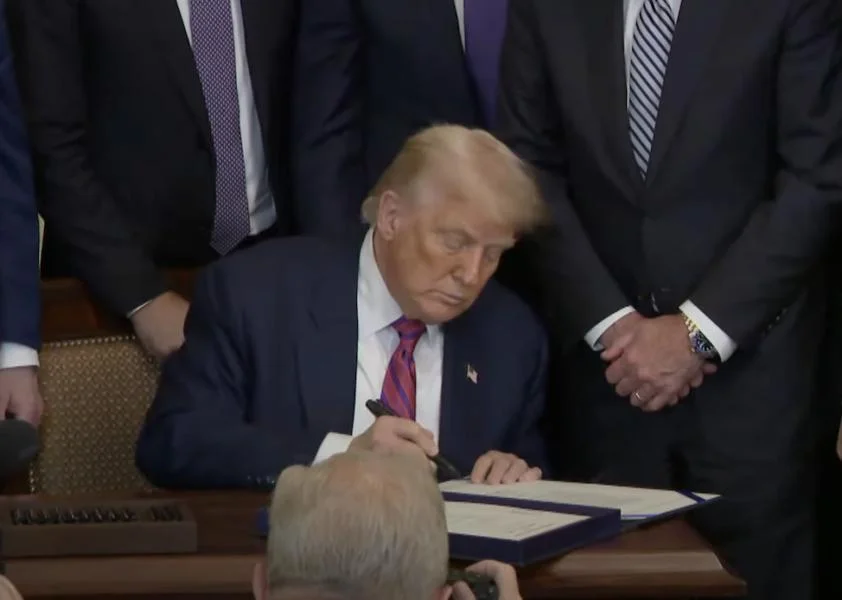 Crypto execs center stage as Trump signs stablecoin bill into law